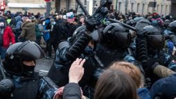 Russian people protest against riot police as activist got arrested