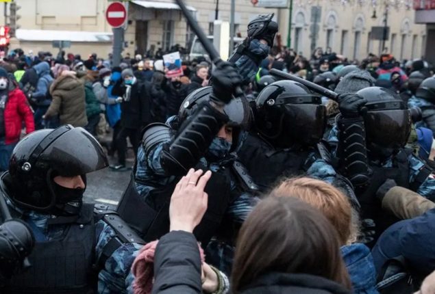 Russian people protest against riot police as activist got arrested
