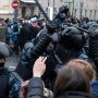 Russian people protest against riot police as activist got arrested
