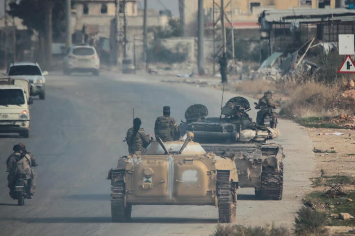 Syrian rebels sweep into Aleppo, army closes airport and roads