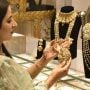Gold prices declines by RS 1,800 per tola in Pakistan  