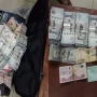 Two held for running illegal currency exchange
