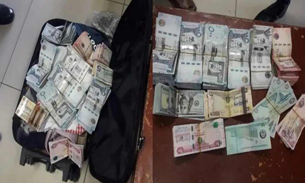 Two held for running illegal currency exchange