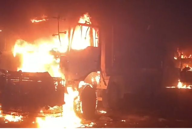 Two siblings killed in Karachi, mob torches seven dumpers