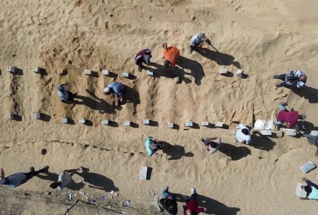 At mass burial in Gaza, Palestinians mourn the unknown dead