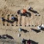At mass burial in Gaza, Palestinians mourn the unknown dead