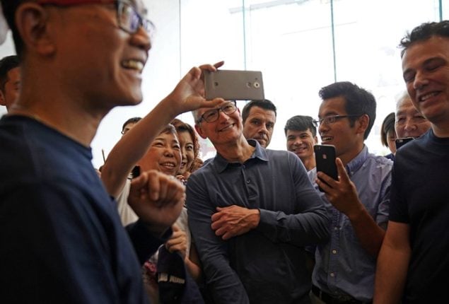 Apple CEO Tim Cook vows to boost Chinese investment amid trade tensions