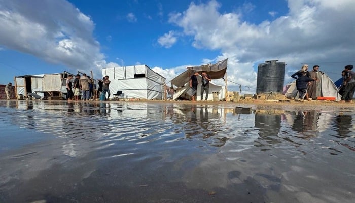 Deadly strikes in Gaza coincide with heavy flooding across strip
