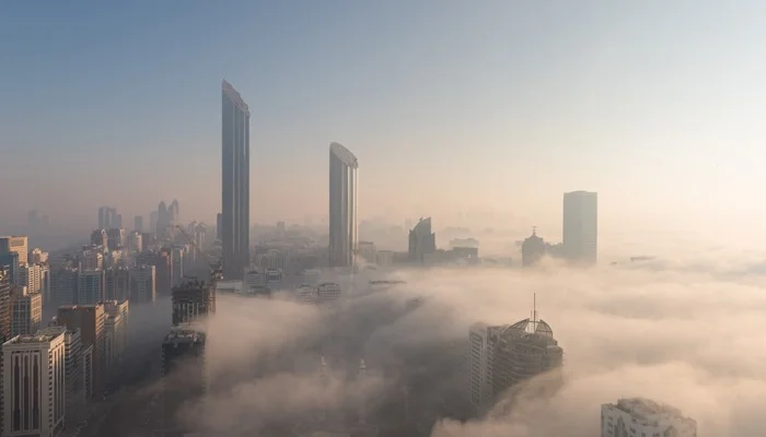 Fog drapes UAE skylines in soft winter-white hues