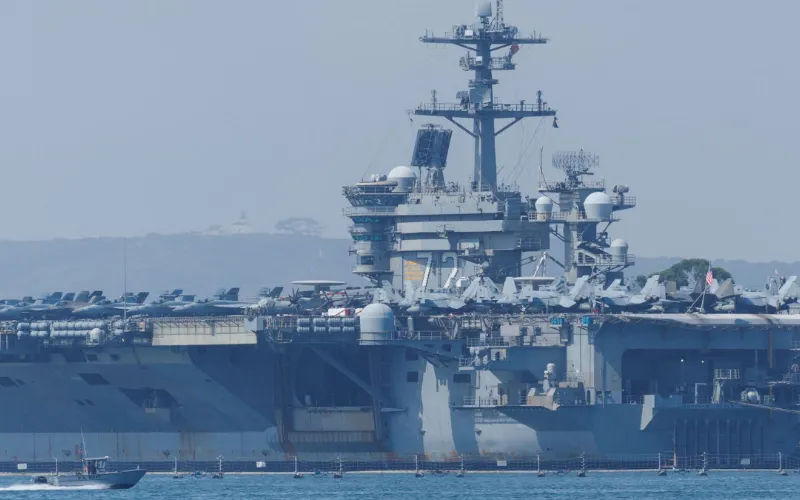 Iran warns any attack will mean 'all-out war' after Trump says US 'armada' on its way